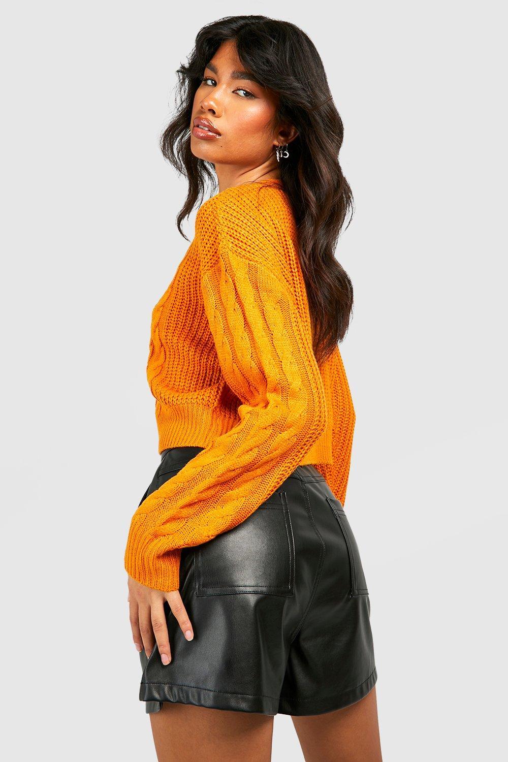 pomarańczowy sweter splot warkocz