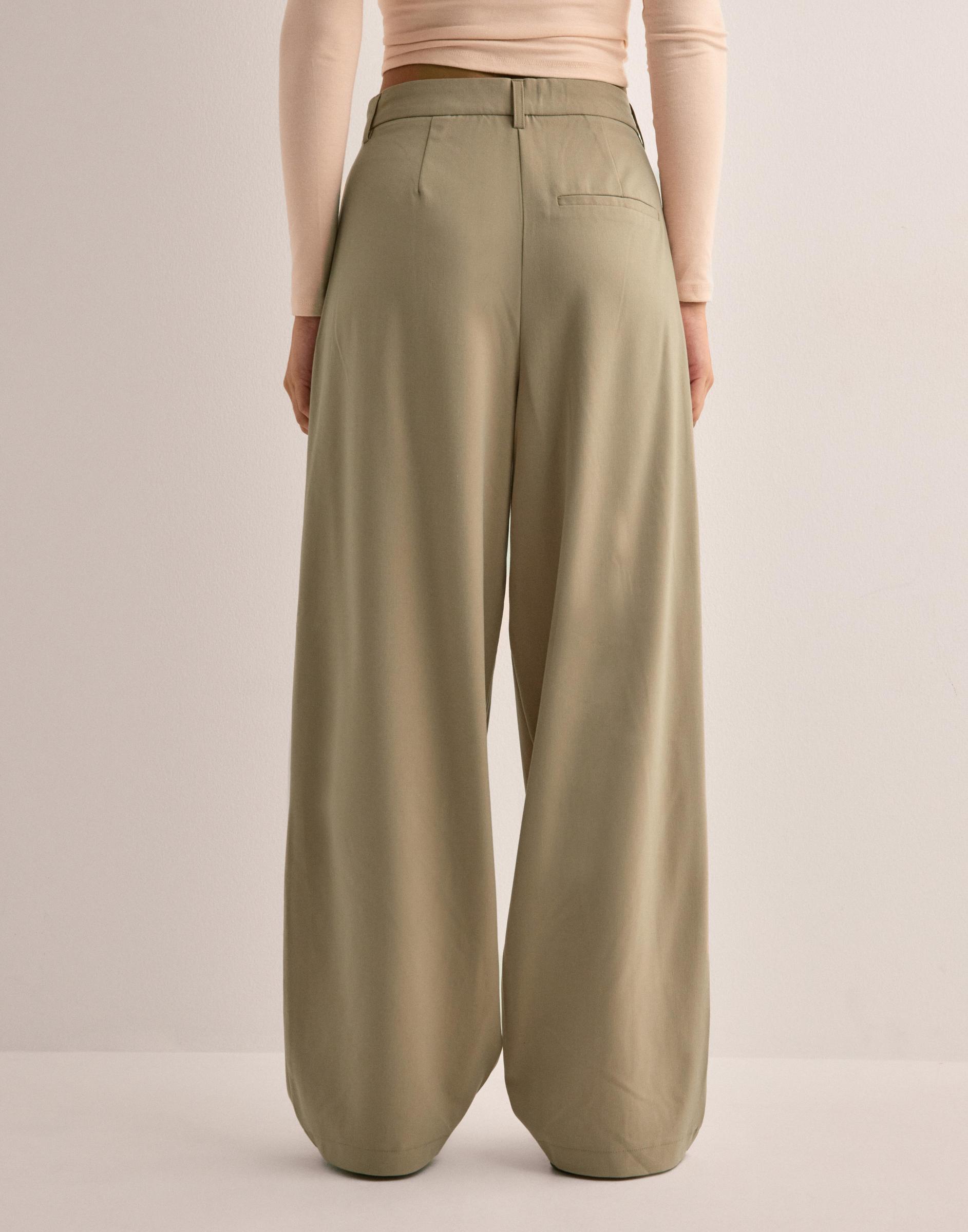 beżowe spodnie baggy kieszenie casual zamek