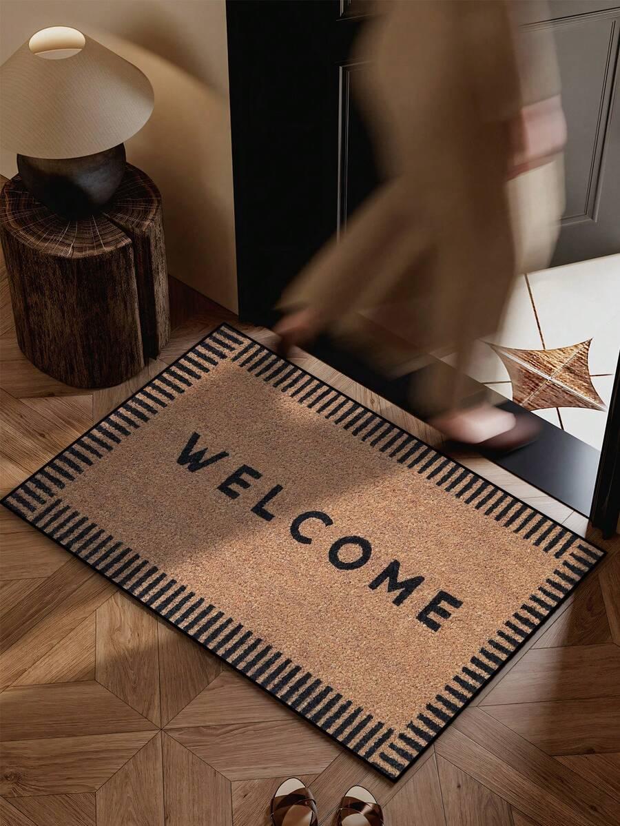 brązowa wycieraczka napis welcome