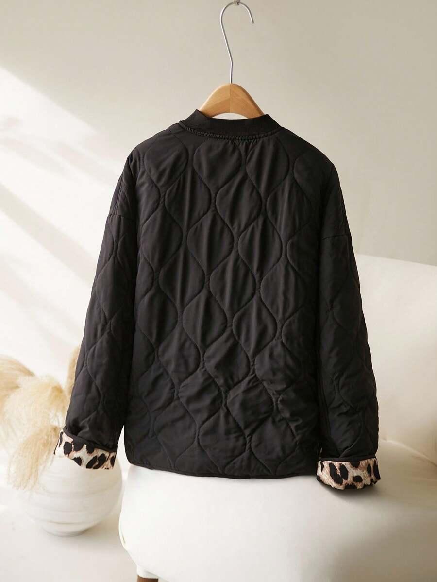 pikowana czarna kurtka animal print guziki