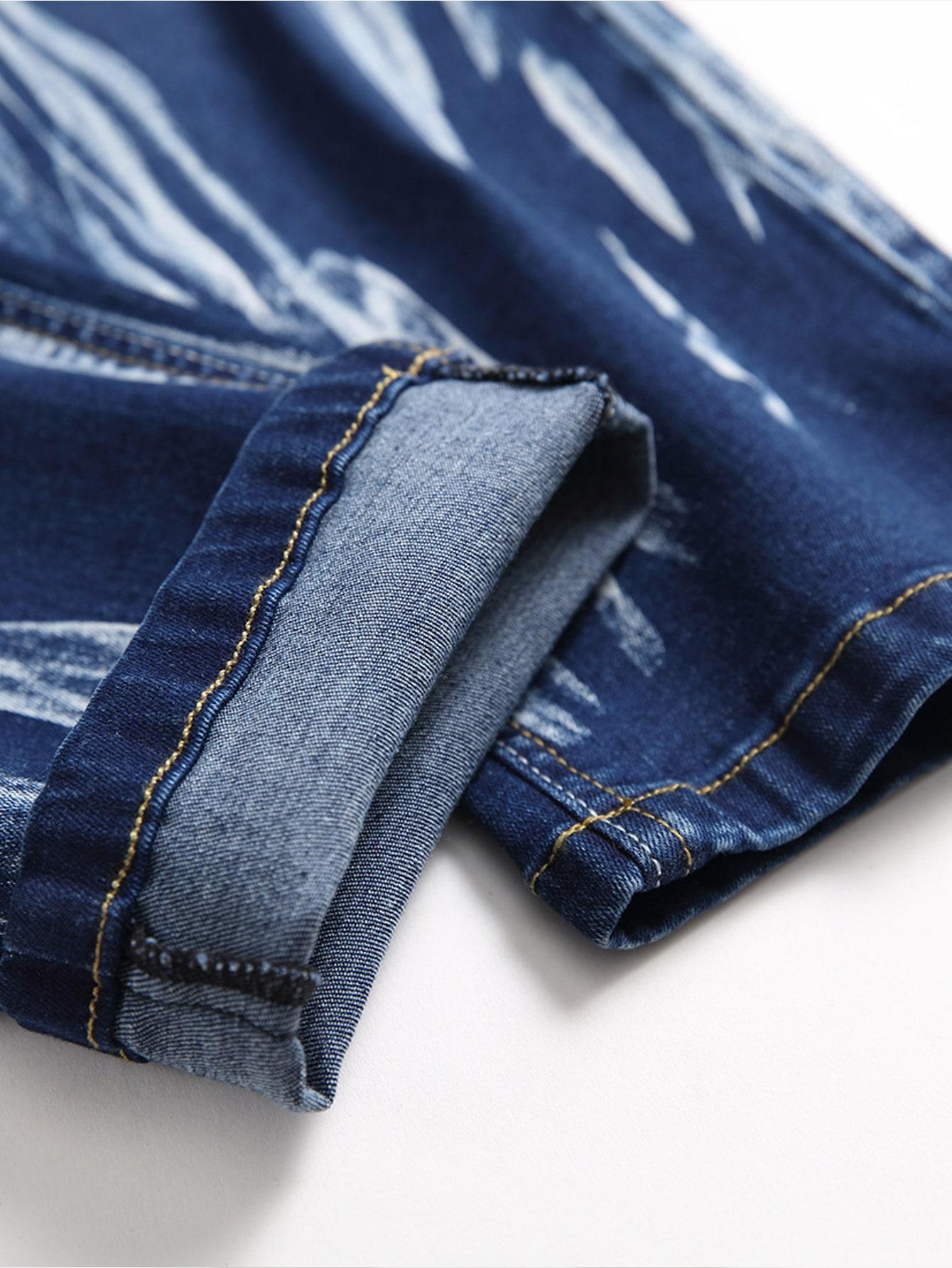 niebieskie spodnie jeansowe przetarcia