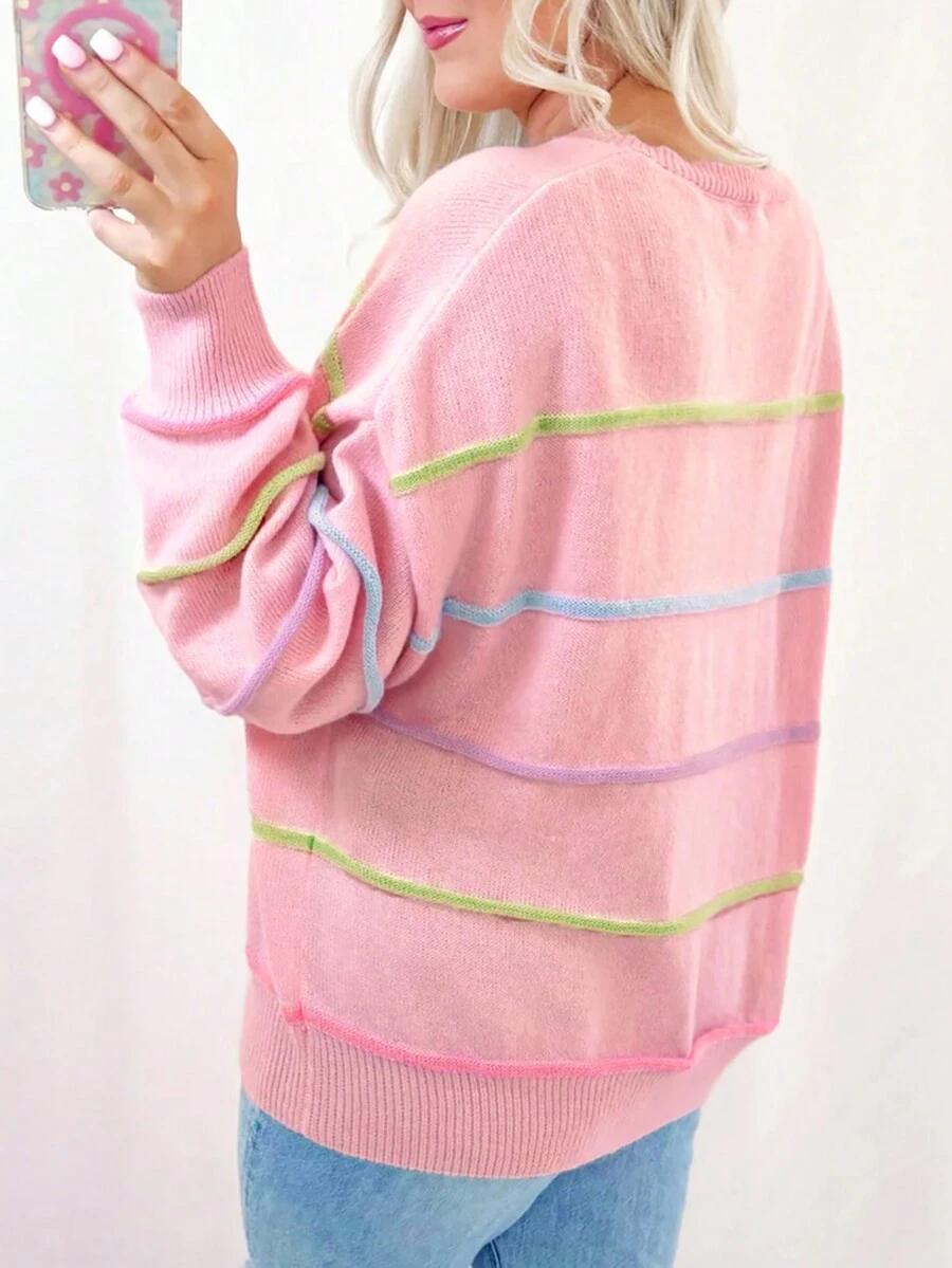 różowy sweter paski