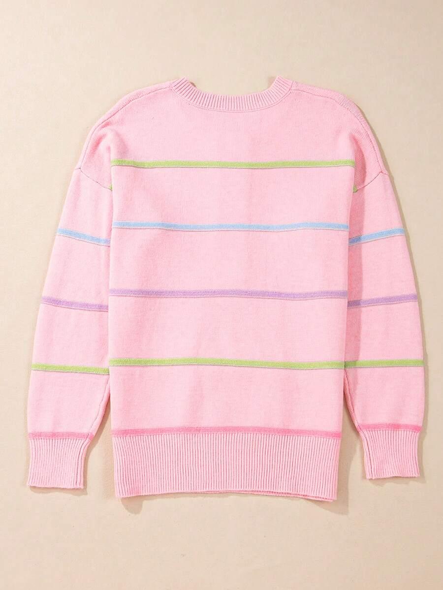 różowy sweter paski