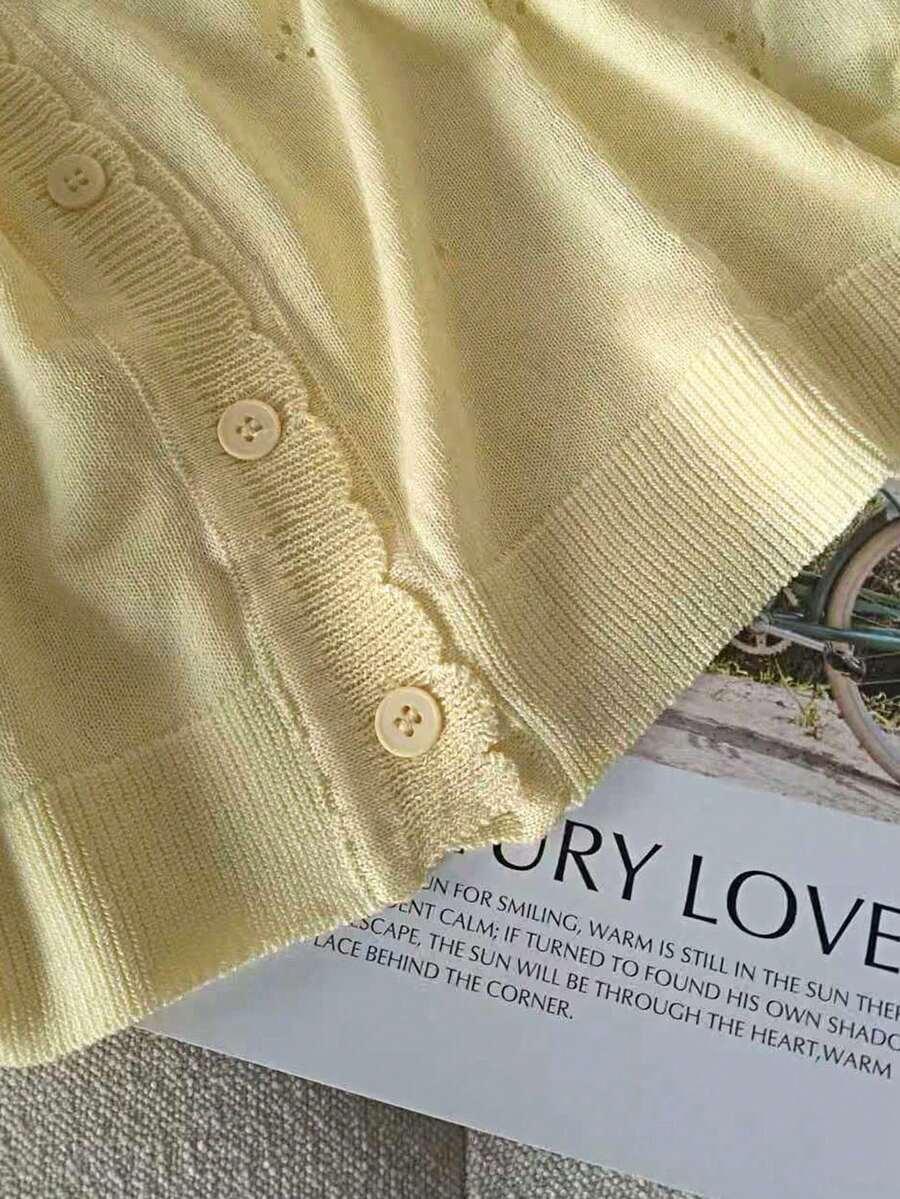 żółty sweter guziki 