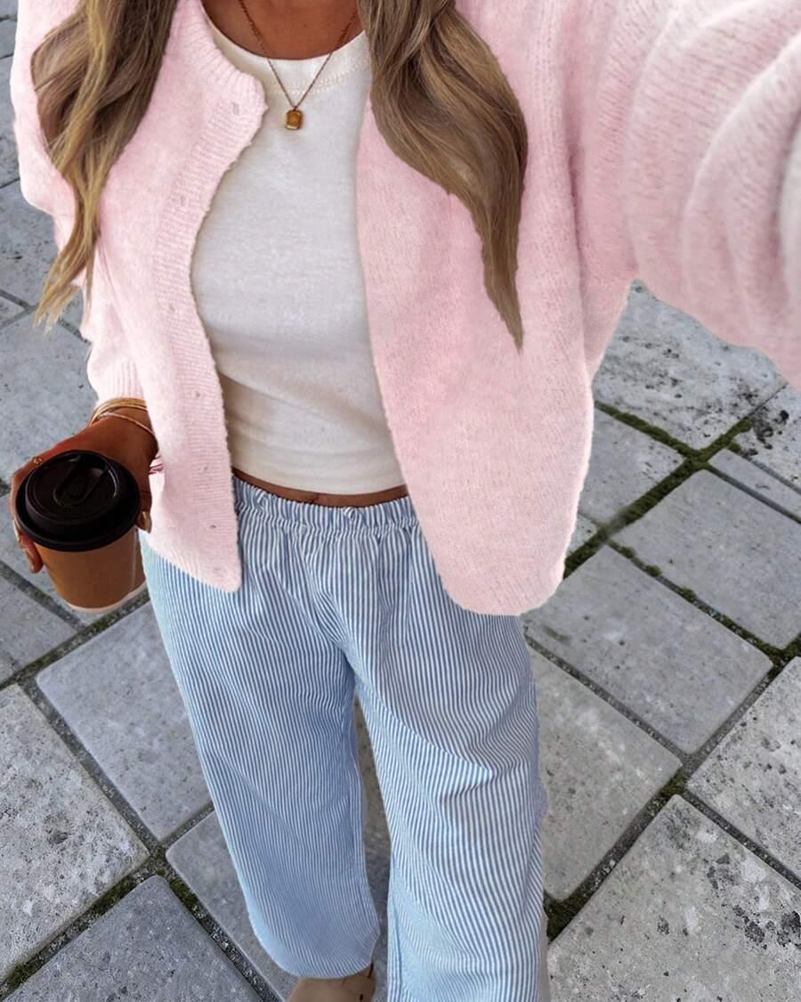 różowy sweter guziki