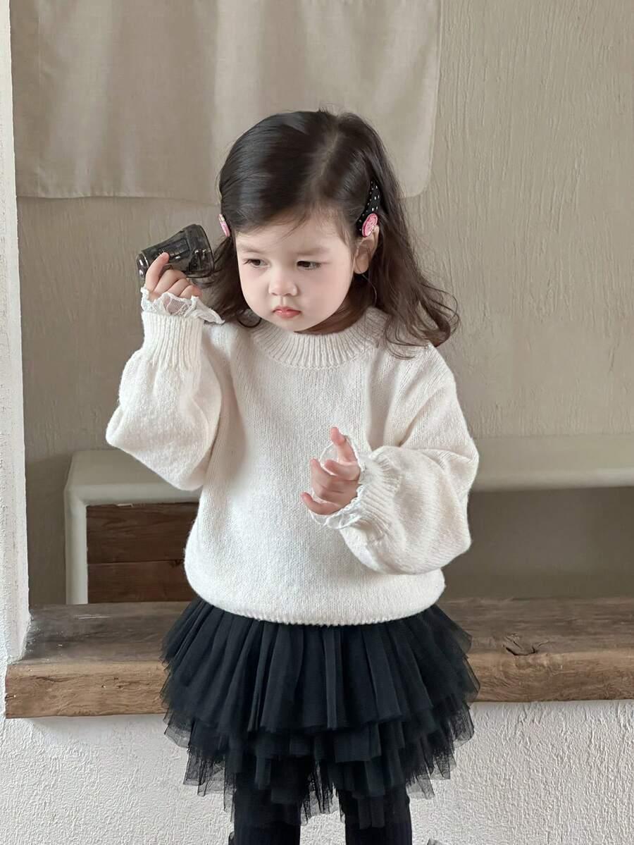 beżowy sweter okrągły dekolt