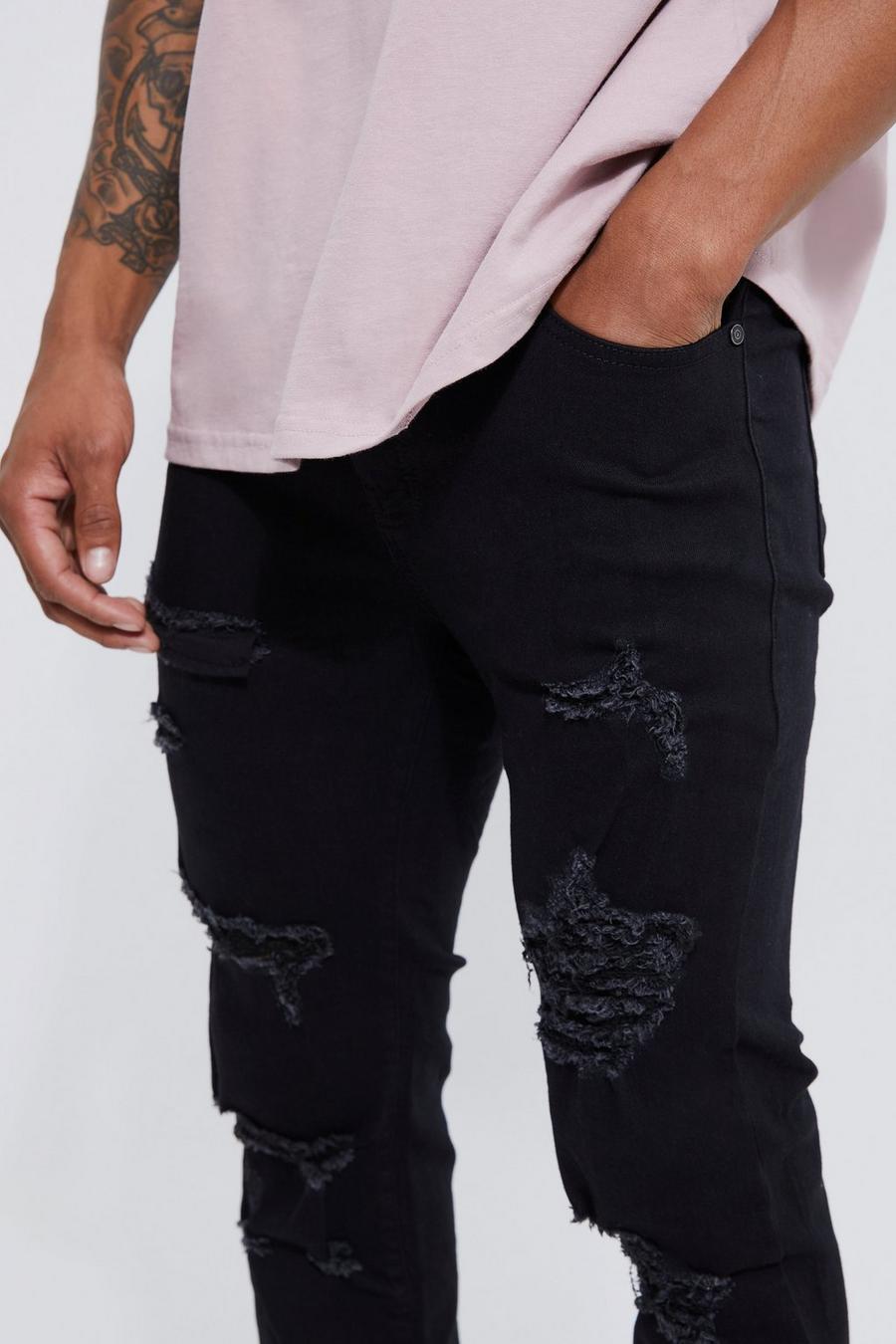 czarne spodnie jeans dziury przetarcia