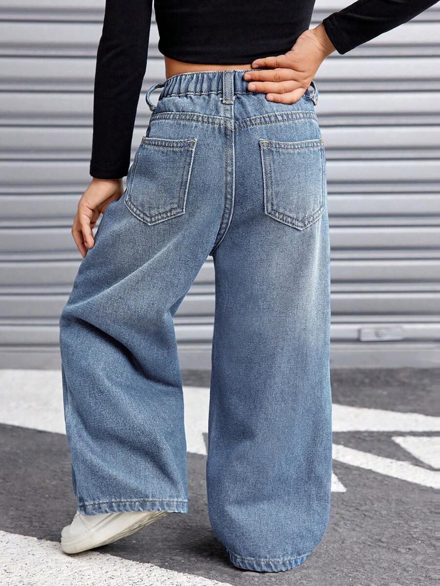 niebieskie spodnie jeans szerokie nogawki kieszenie