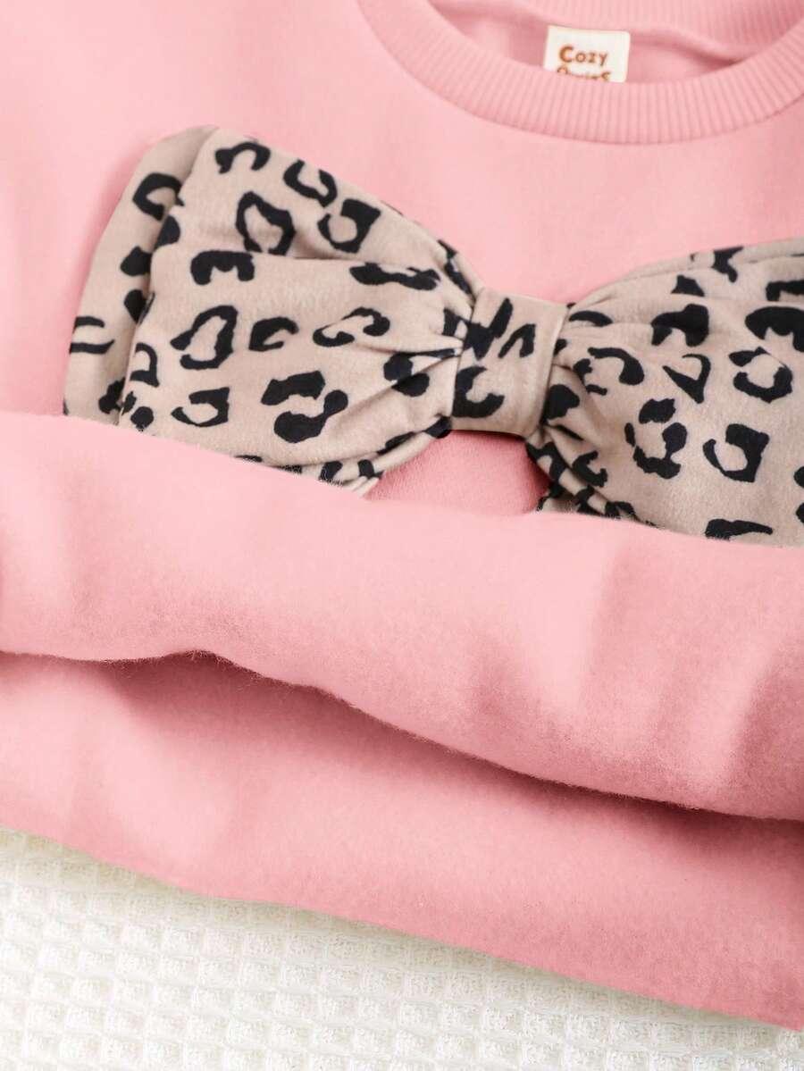 różowa bluza kokarda