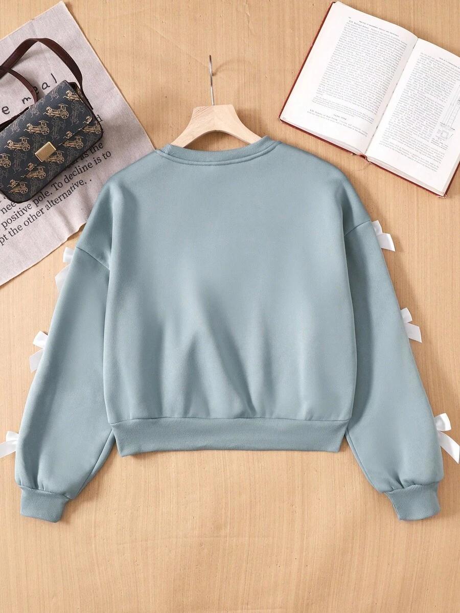 BLUZA DZIECIĘCA Z KOKADTKAMI NA RĘKAWACH