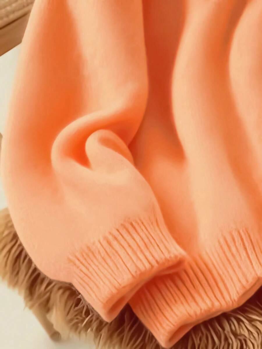 pomarańczowy dzianinowy sweter