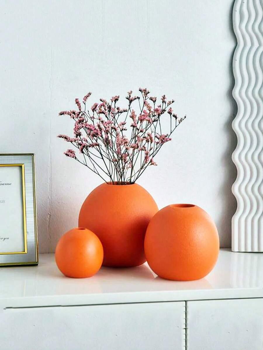 pomarańczowy okrągły wazon