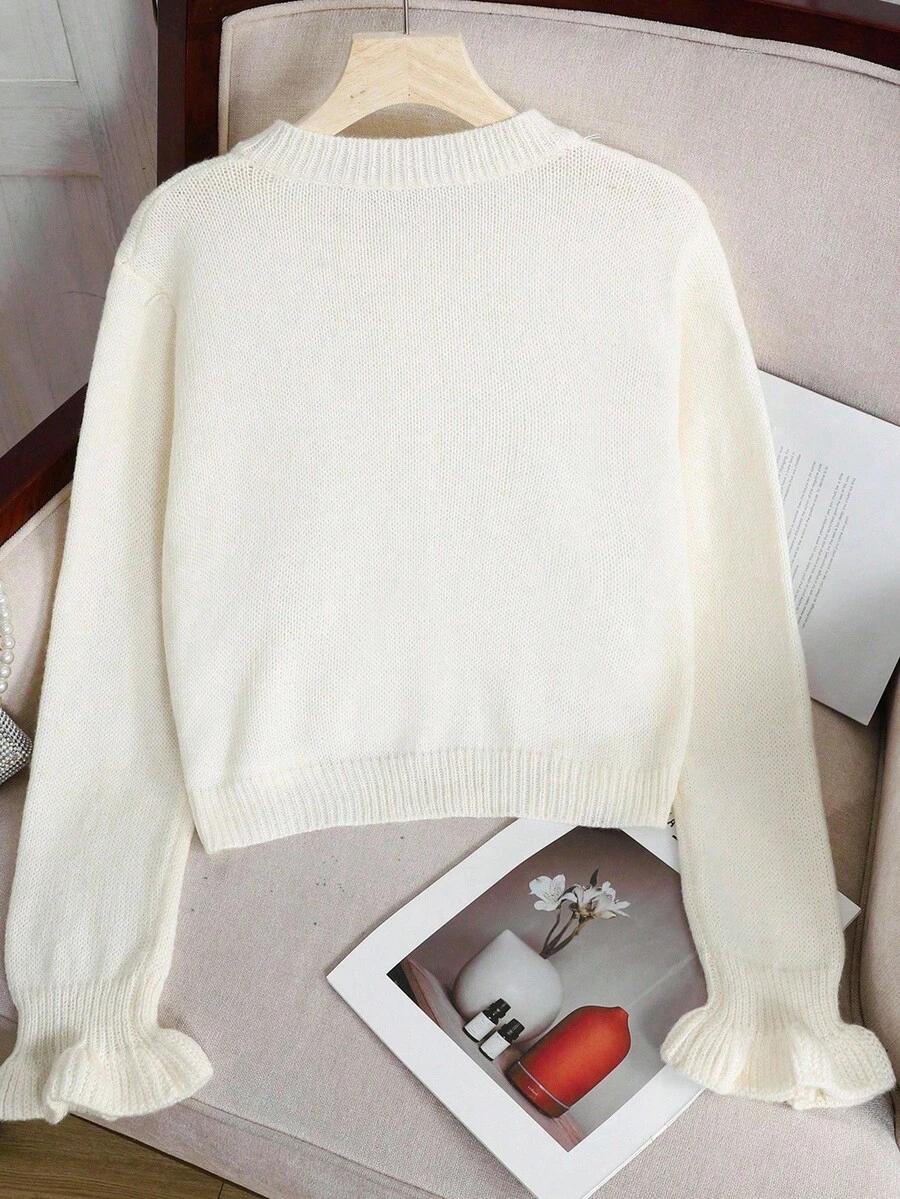 kremowy dzianinowy sweter