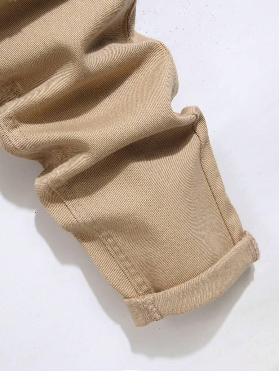BEŻOWE SPODNIE JEANS PRZETARCIA