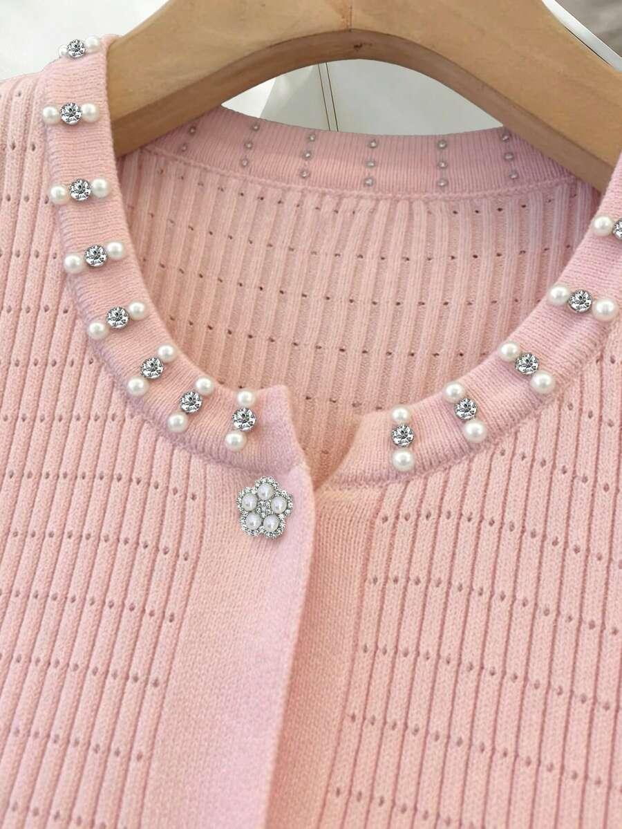 różowy dzianinowy sweter