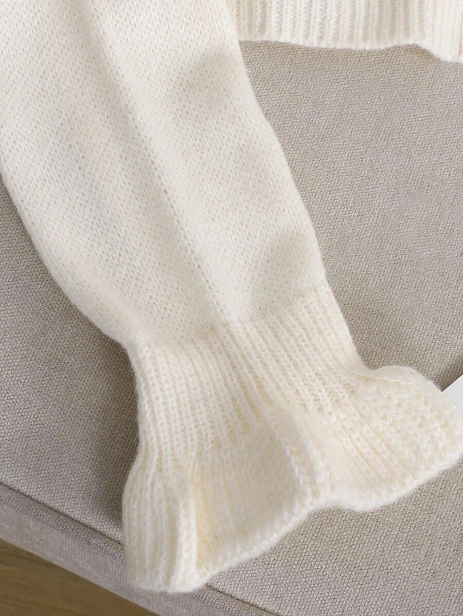 kremowy dzianinowy sweter