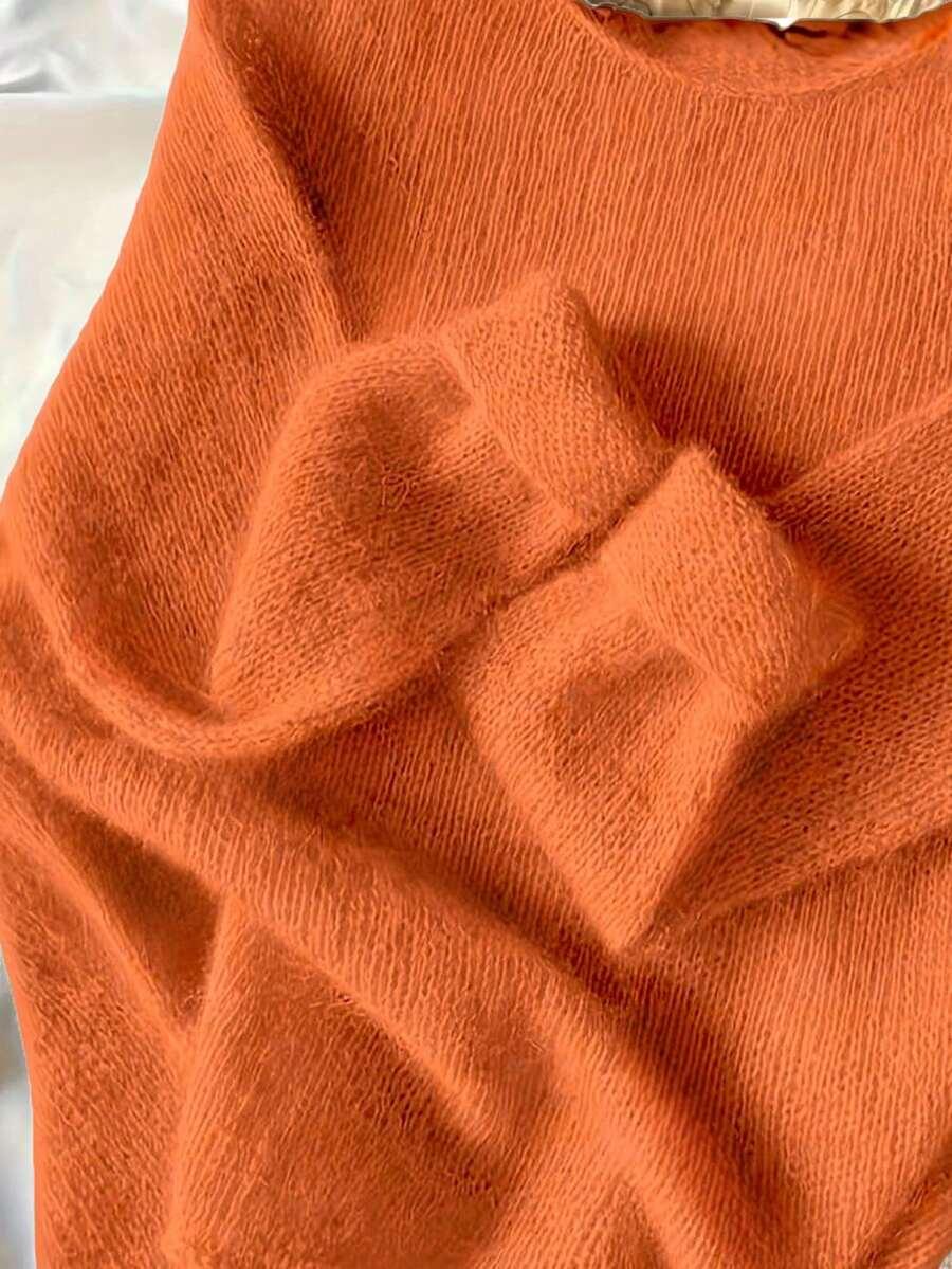 pomarańczowy sweter okrągły dekolt