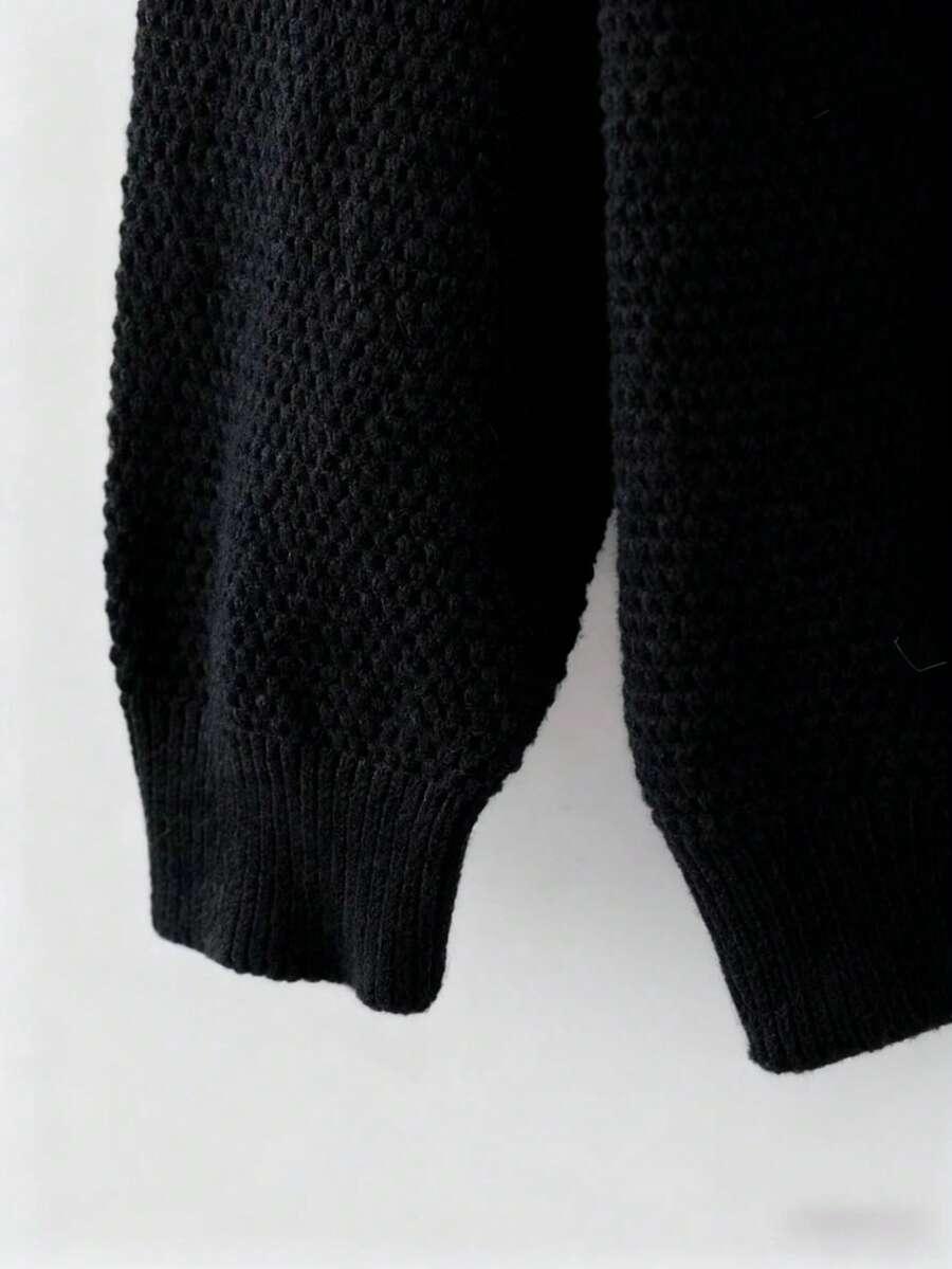 czarny sweter falbana