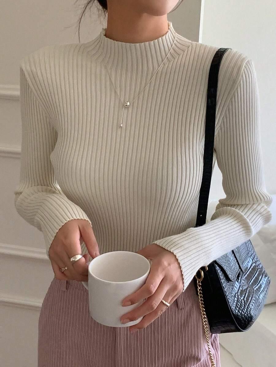BEŻOWY SWETER PRĄŻKI