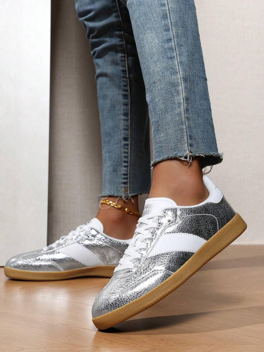 srebrne sznurowane buty sportowe 