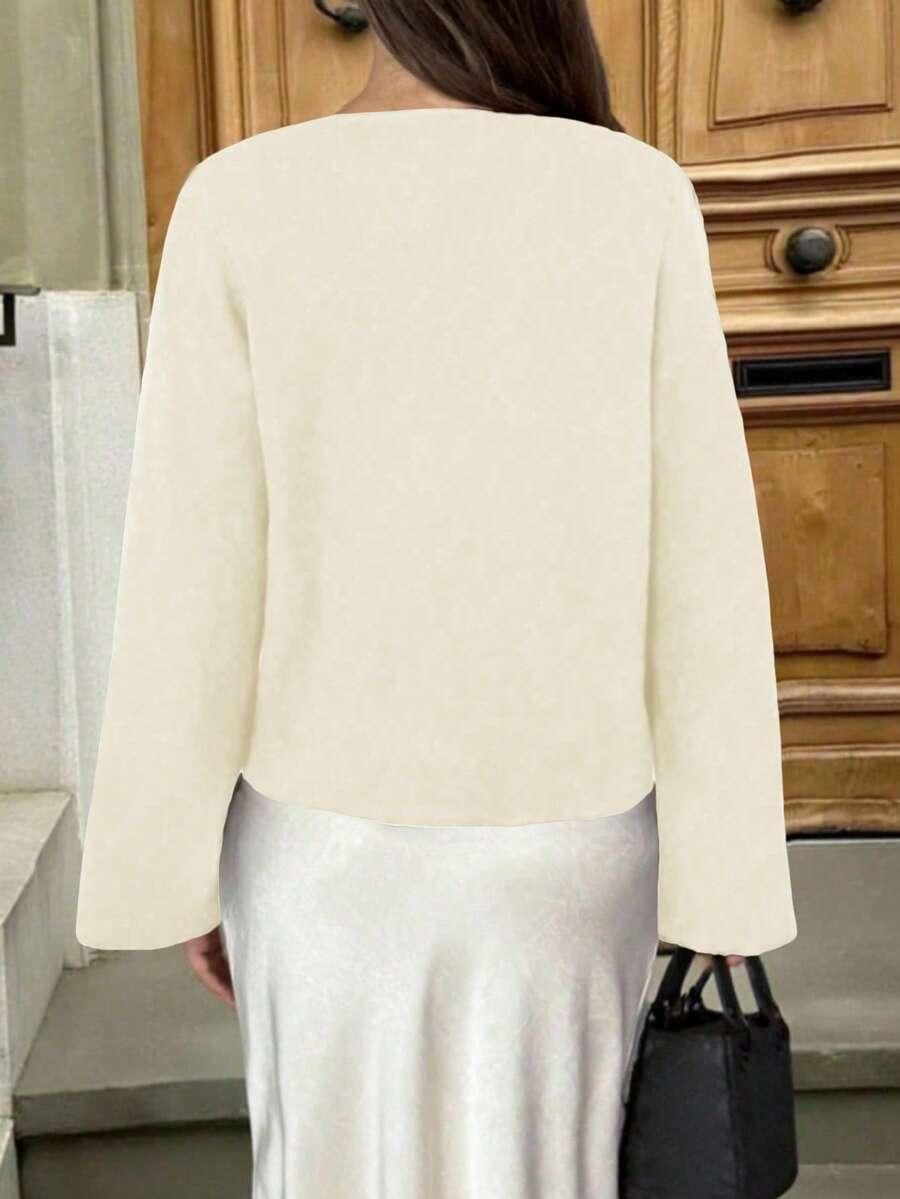 kremowy sweter zdobienie