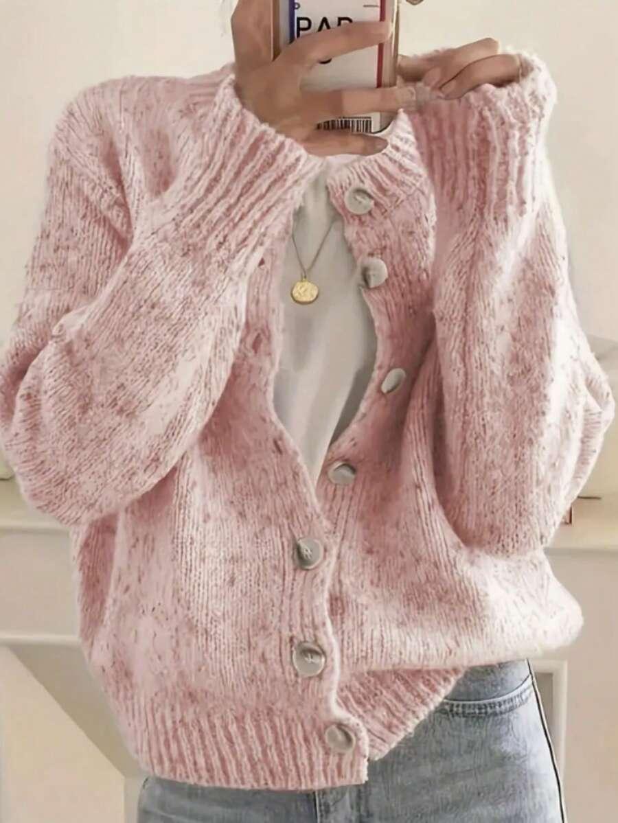 różowy sweter zapinany guziki