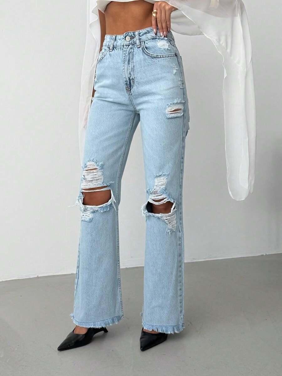 niebieskie spodnie jeans przetarcia