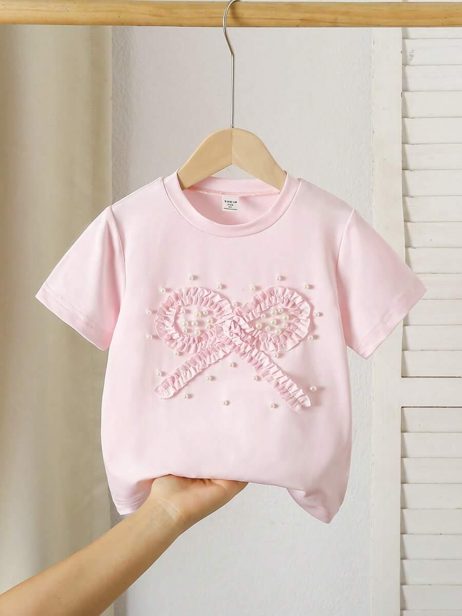 różowy t-shirt kokarda