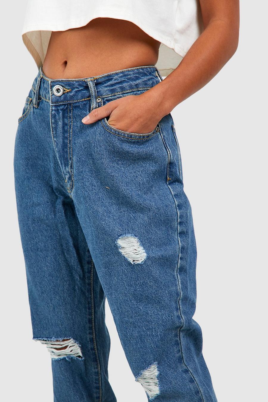 SPODNIE JEANS PRZETARCIA 