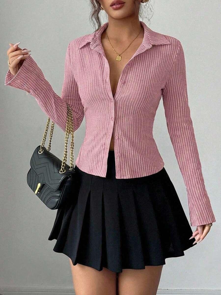 różowa bluzka w paski guziki