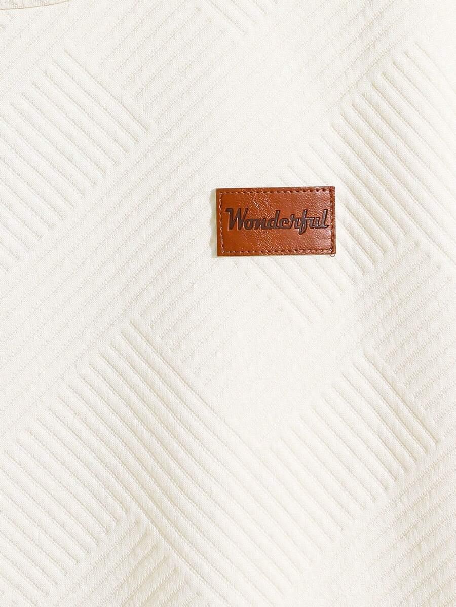BEŻOWY T-SHIRT Z NASZYWKĄ
