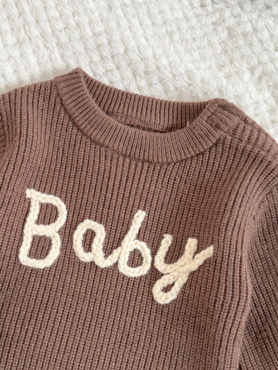 komplet sweter spodnie wzór paski 