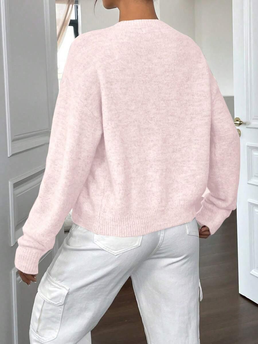 RÓŻOWY SWETER GUZIKI
