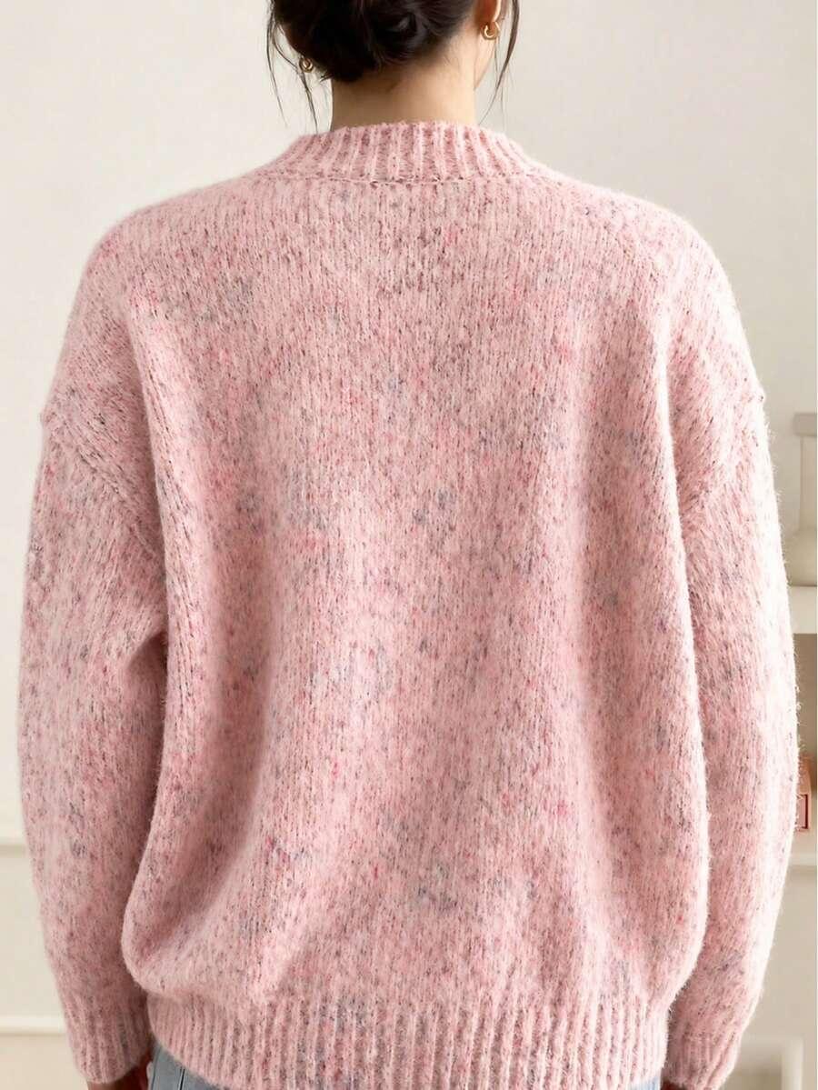 różowy sweter zapinany guziki