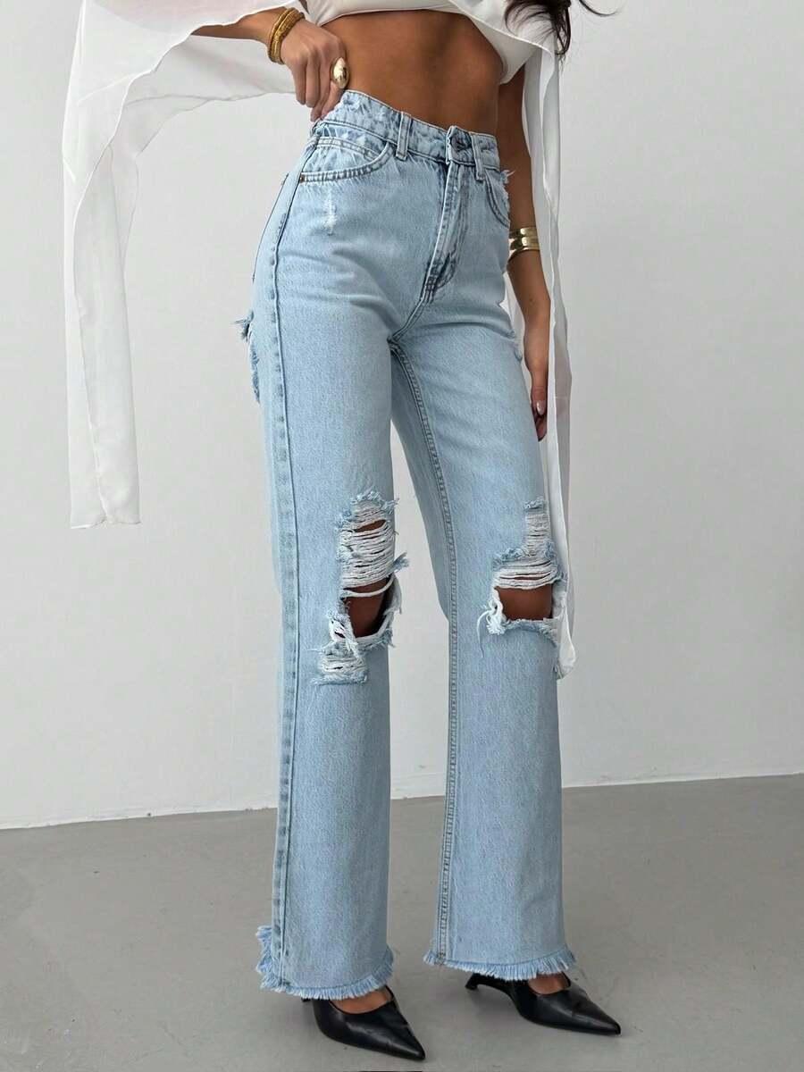 niebieskie spodnie jeans przetarcia