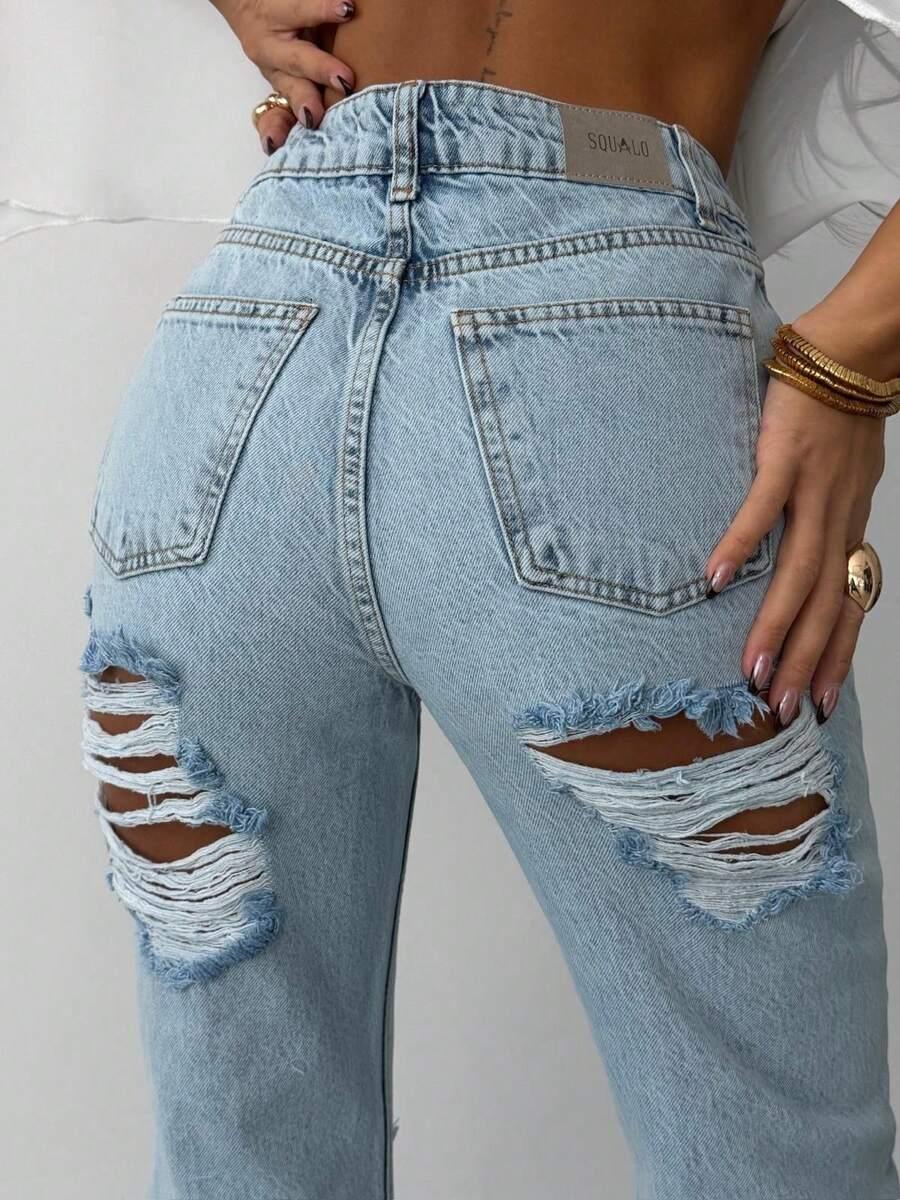 niebieskie spodnie jeans przetarcia