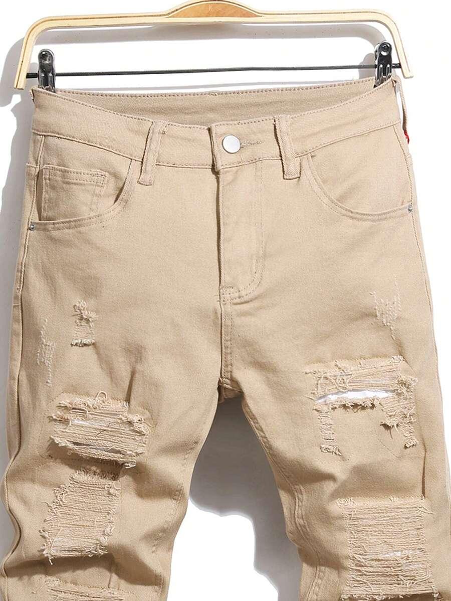 BEŻOWE SPODNIE JEANS PRZETARCIA