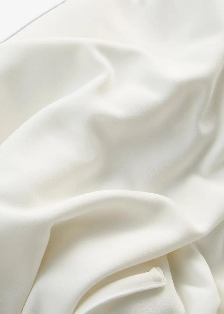 BLUZKA DAMSKA PLUS SIZE Z OKRĄGŁYM DEKOLTEM I KRÓTKIM RĘKAWEM